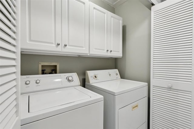 laundry area featuring cabinet space and separate washer and dryer