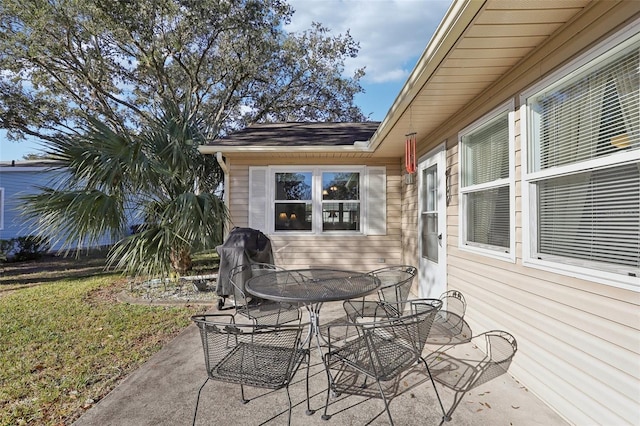 view of patio / terrace featuring outdoor dining area and a grill