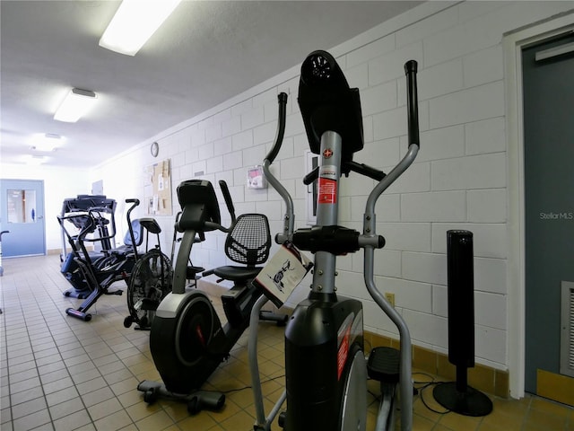 exercise room featuring tile patterned flooring and visible vents