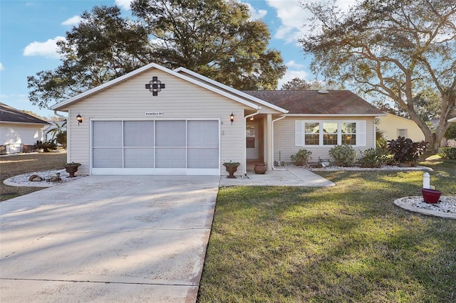 ranch-style home with an attached garage, driveway, and a front lawn