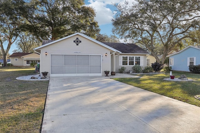 ranch-style home with an attached garage, concrete driveway, and a front lawn