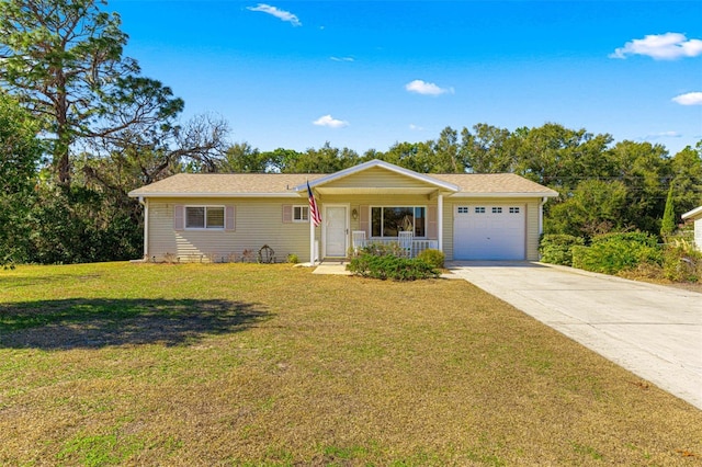 ranch-style home featuring covered porch, a garage, and a front lawn