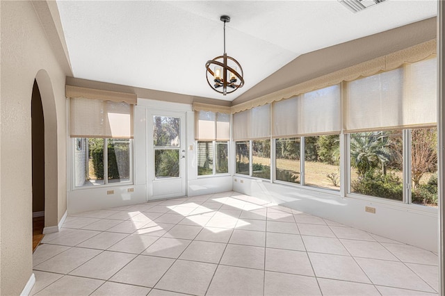 unfurnished sunroom featuring a wealth of natural light, an inviting chandelier, and lofted ceiling