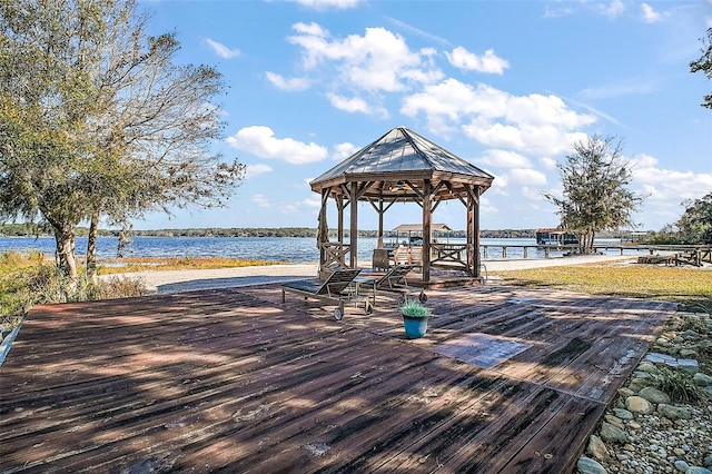 view of dock with a water view and a gazebo