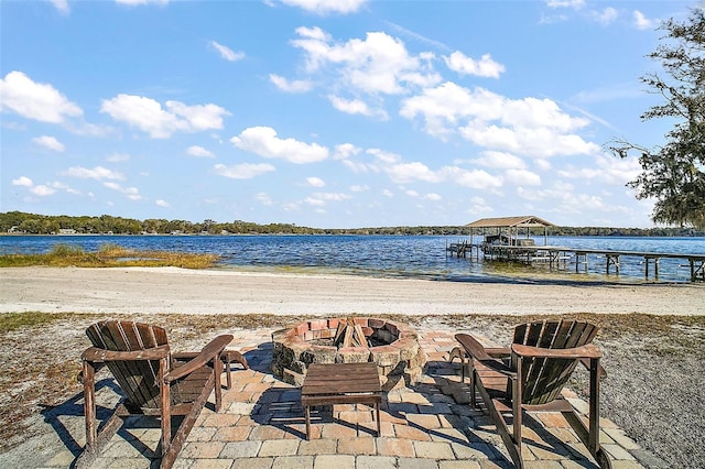 property view of water featuring a fire pit