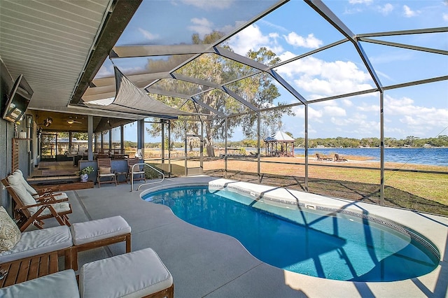 view of swimming pool featuring a lanai, a water view, and a patio