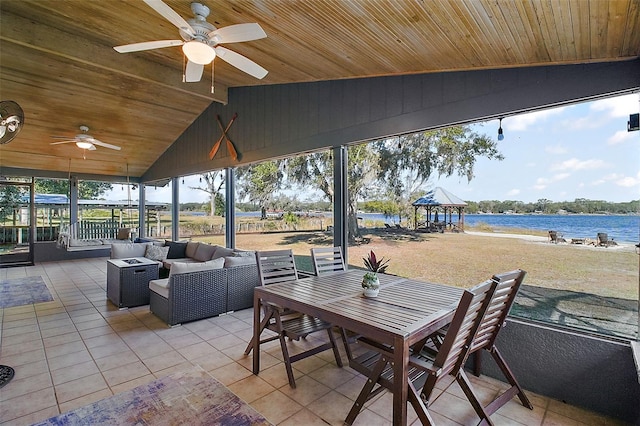 view of patio / terrace featuring a water view, an outdoor hangout area, ceiling fan, and a gazebo