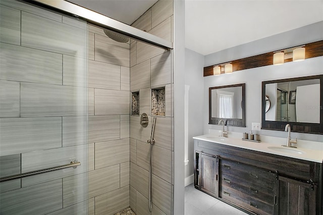 bathroom featuring an enclosed shower and vanity