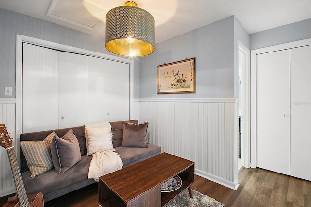 living room with dark hardwood / wood-style flooring