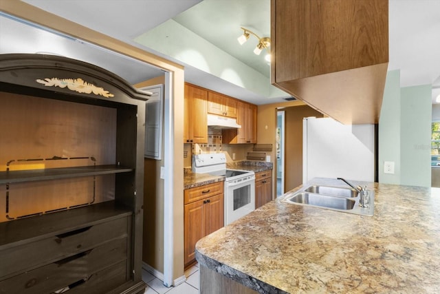 kitchen with light tile patterned floors, white electric range, refrigerator, and sink