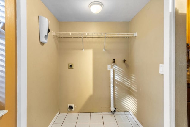 laundry area featuring washer hookup, light tile patterned floors, and electric dryer hookup