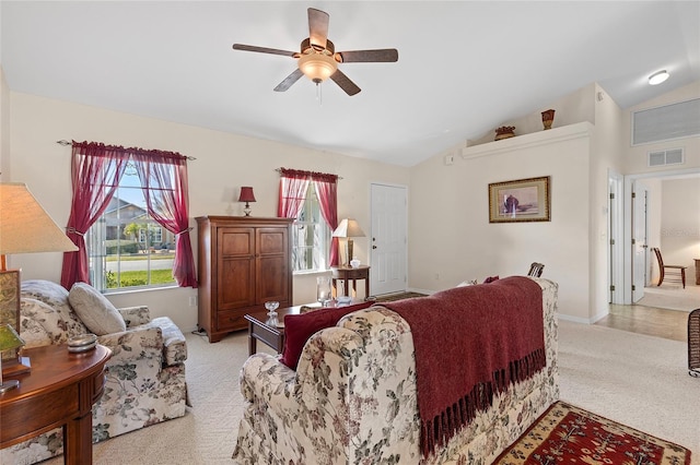 living room featuring lofted ceiling, light colored carpet, and ceiling fan