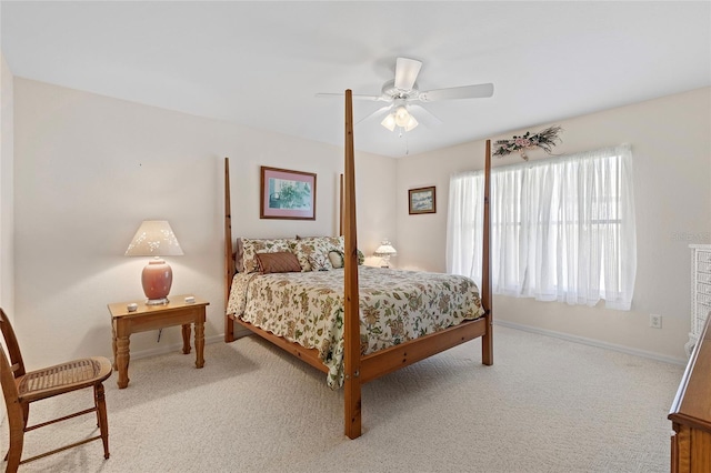 bedroom with ceiling fan and light colored carpet