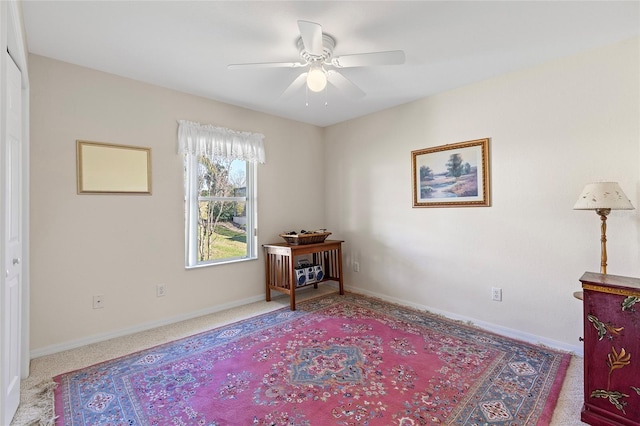 interior space with ceiling fan