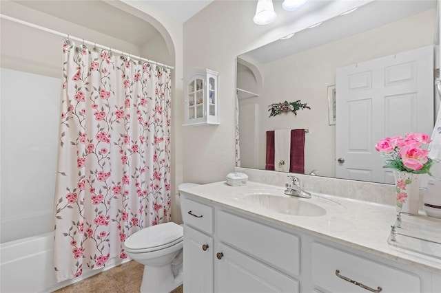 full bathroom featuring tile patterned flooring, vanity, shower / tub combo, and toilet