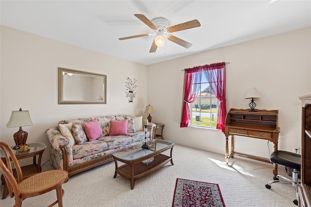 carpeted living room with ceiling fan