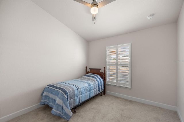 carpeted bedroom featuring ceiling fan and lofted ceiling