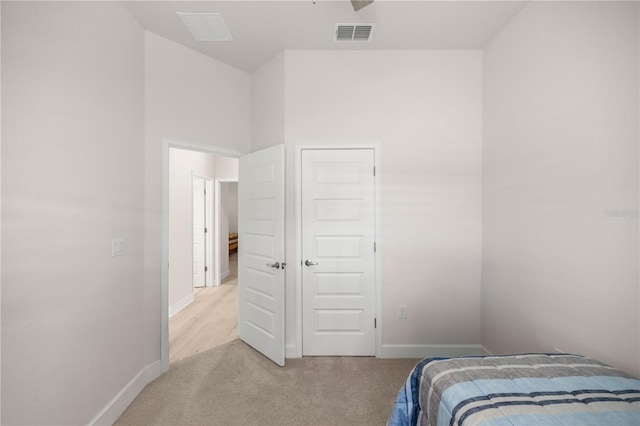 carpeted bedroom with a closet