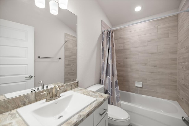 full bathroom with toilet, vanity, and shower / bath combo with shower curtain