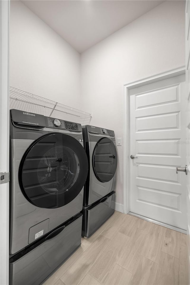 washroom with washer and clothes dryer