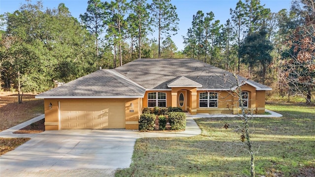 ranch-style home featuring a front yard and a garage