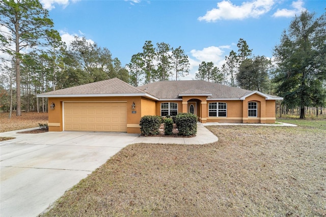 single story home with a front yard and a garage