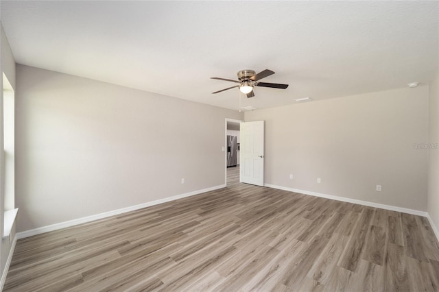 unfurnished room featuring light wood-type flooring and ceiling fan