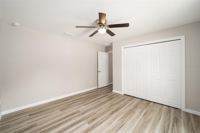 unfurnished bedroom with a closet, ceiling fan, and light hardwood / wood-style flooring