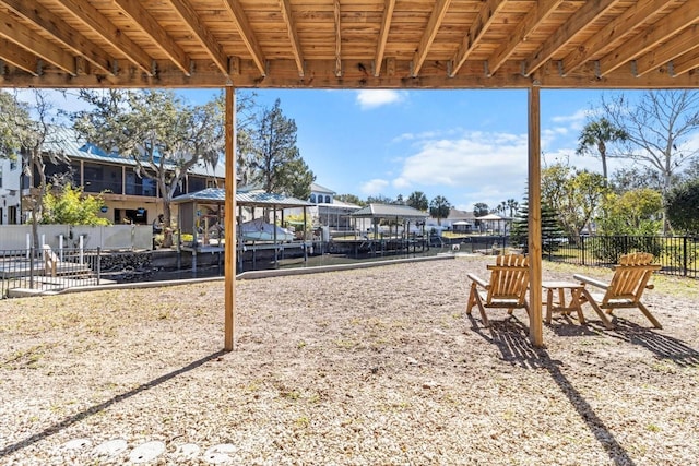 exterior space featuring fence and a residential view