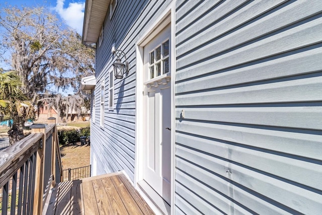 view of side of home with a deck