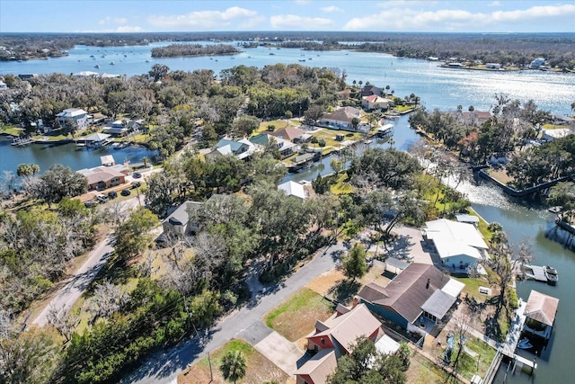 drone / aerial view featuring a residential view and a water view