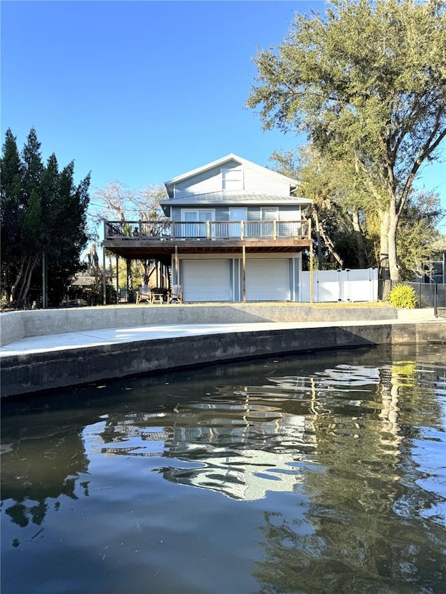 exterior space with a water view and a garage