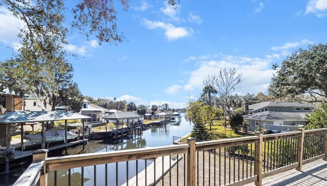 exterior space featuring a water view, boat lift, and a residential view