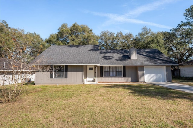 ranch-style house with a garage and a front yard