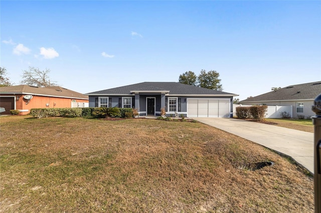 single story home with a front yard and a garage