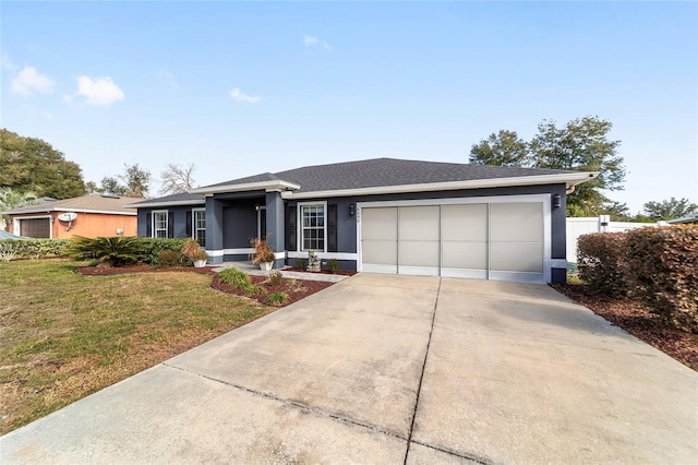 ranch-style house featuring a garage and a front lawn