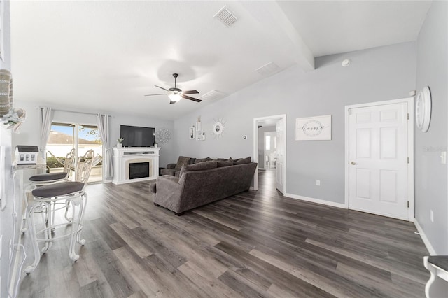 living room with ceiling fan, vaulted ceiling with beams, and dark hardwood / wood-style floors