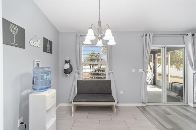 living area with a notable chandelier