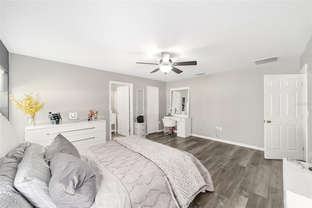 bedroom with ceiling fan and dark hardwood / wood-style floors