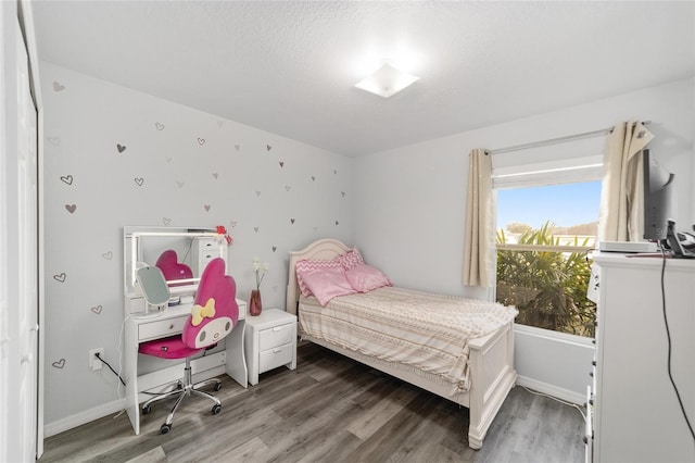 bedroom with hardwood / wood-style floors