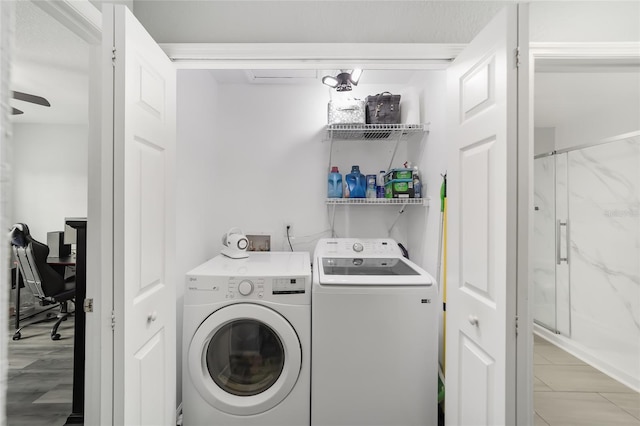 laundry room featuring washer and clothes dryer