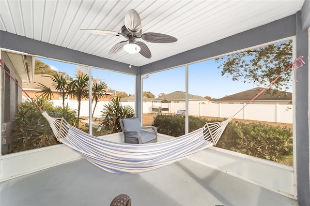 sunroom featuring ceiling fan