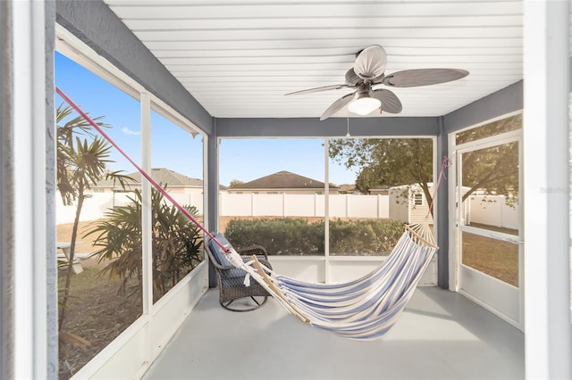 sunroom / solarium with ceiling fan