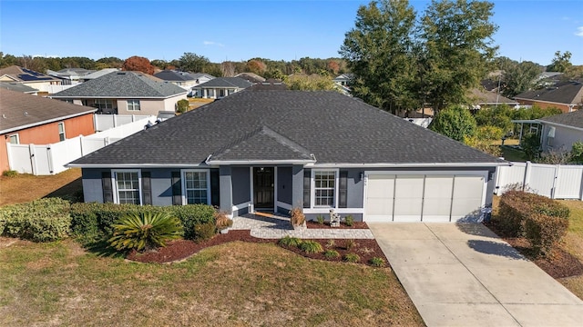 ranch-style home featuring a garage and a front yard