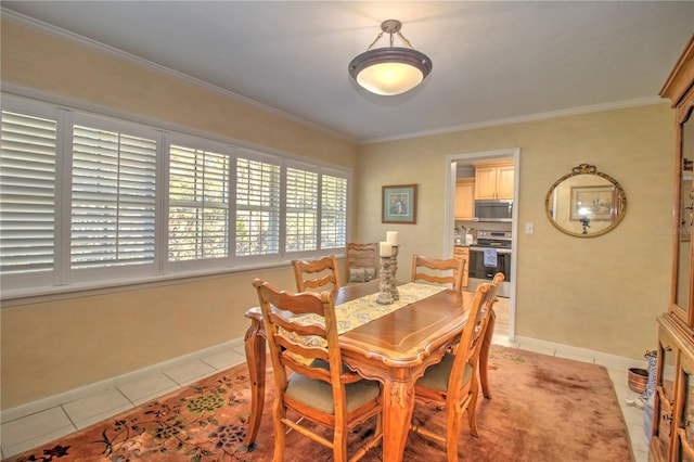 dining space featuring ornamental molding and light tile patterned flooring