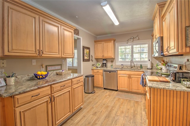 kitchen with light hardwood / wood-style flooring, appliances with stainless steel finishes, sink, light stone countertops, and ornamental molding