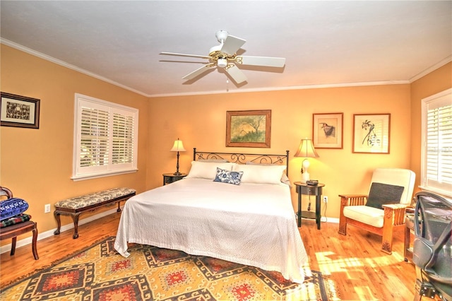 bedroom with ceiling fan, light hardwood / wood-style flooring, and ornamental molding