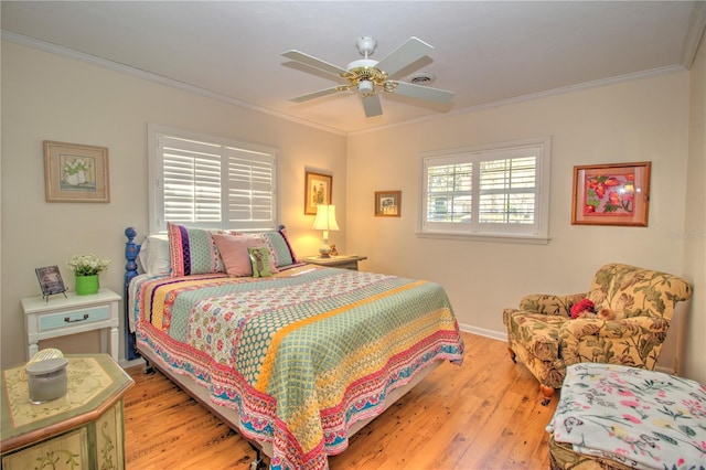 bedroom featuring light wood-type flooring, ceiling fan, and crown molding