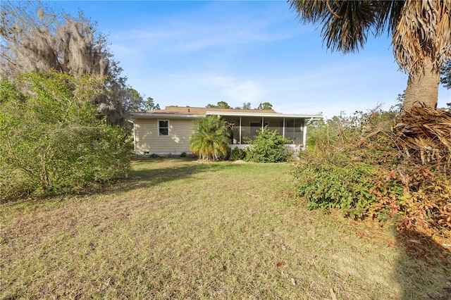 view of yard featuring a sunroom