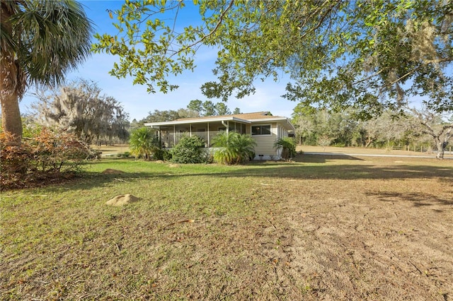 view of yard with a sunroom